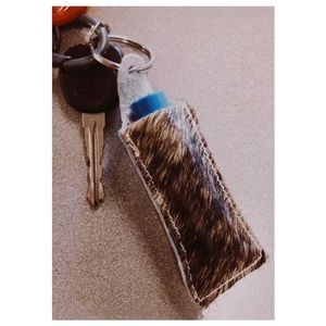 Hair on hide keychain chapstick holders.
